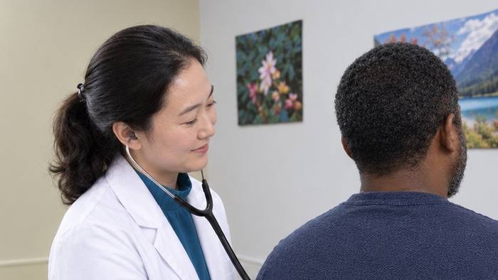 Dr. Claire Li examining a patient
